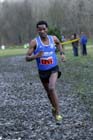 Eritrean athlete Weynay Ghebresilasie running for Sunderland Harriers on his way to third place in the Start First North East Harrier League, Jarrow.